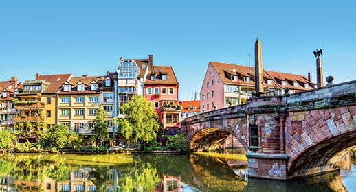 Colourful houses and bridge on the banks of River Pegnitz, Germany